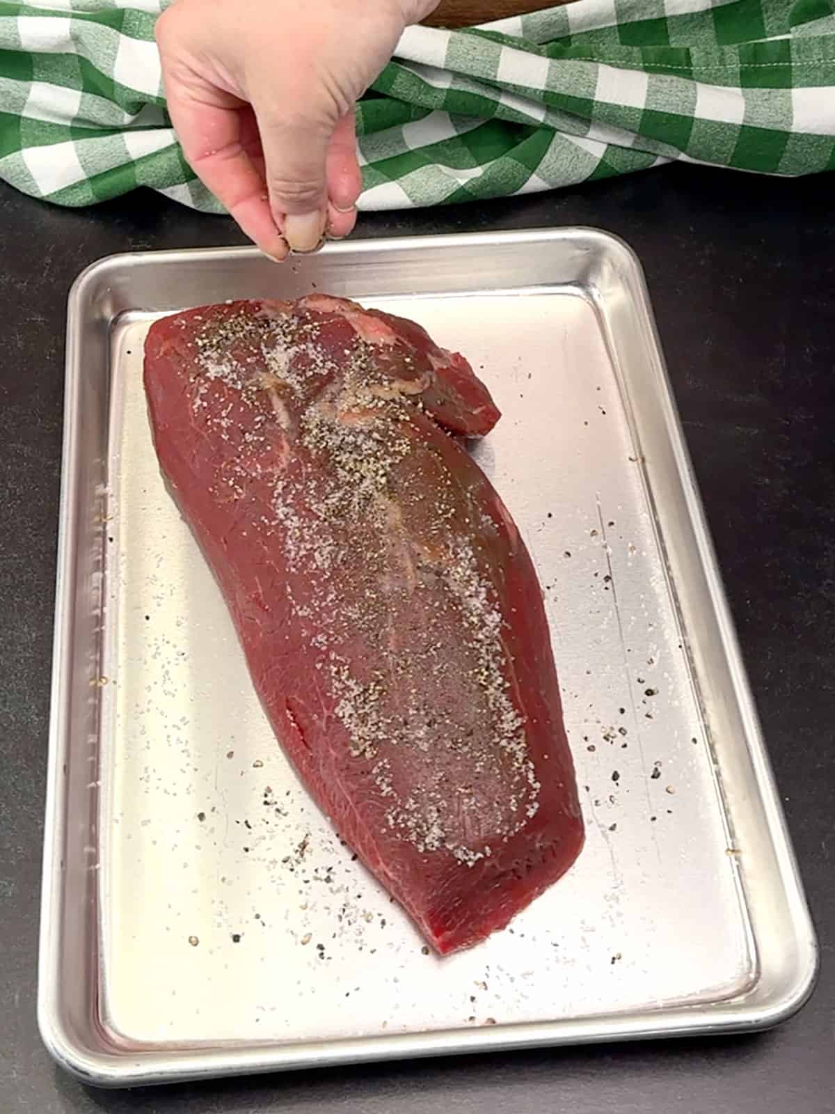 seasoning roast with salt and pepper
