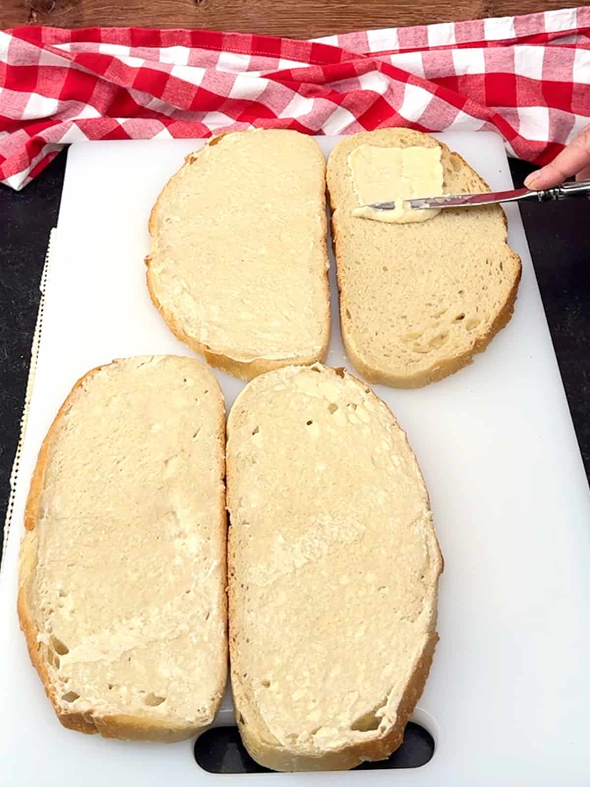 spreading butter mixture on bread