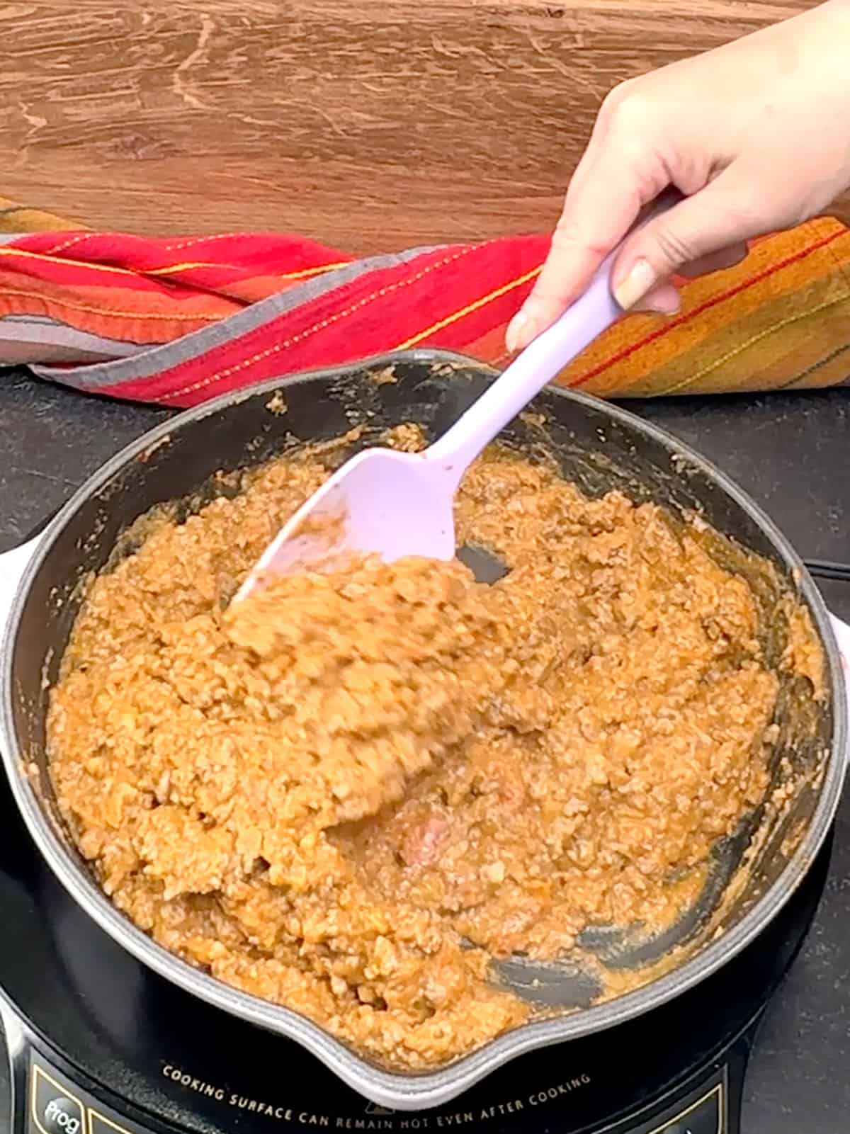 stirring finished meat mixture