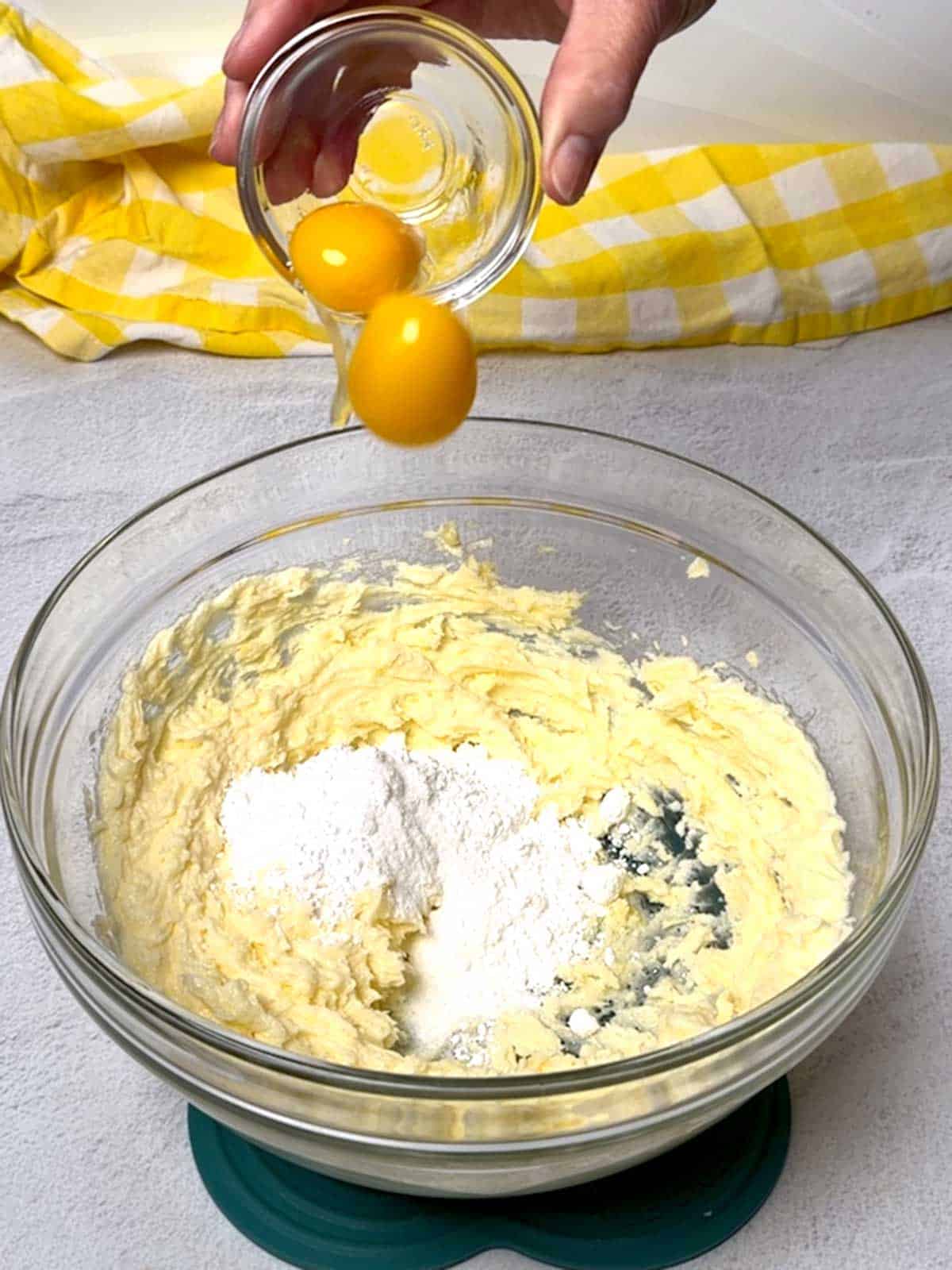 Adding Egg Yolks to the dough.