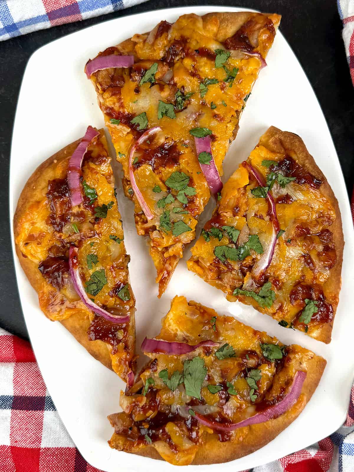 barbecue chicken flatbread pizza cut into slices