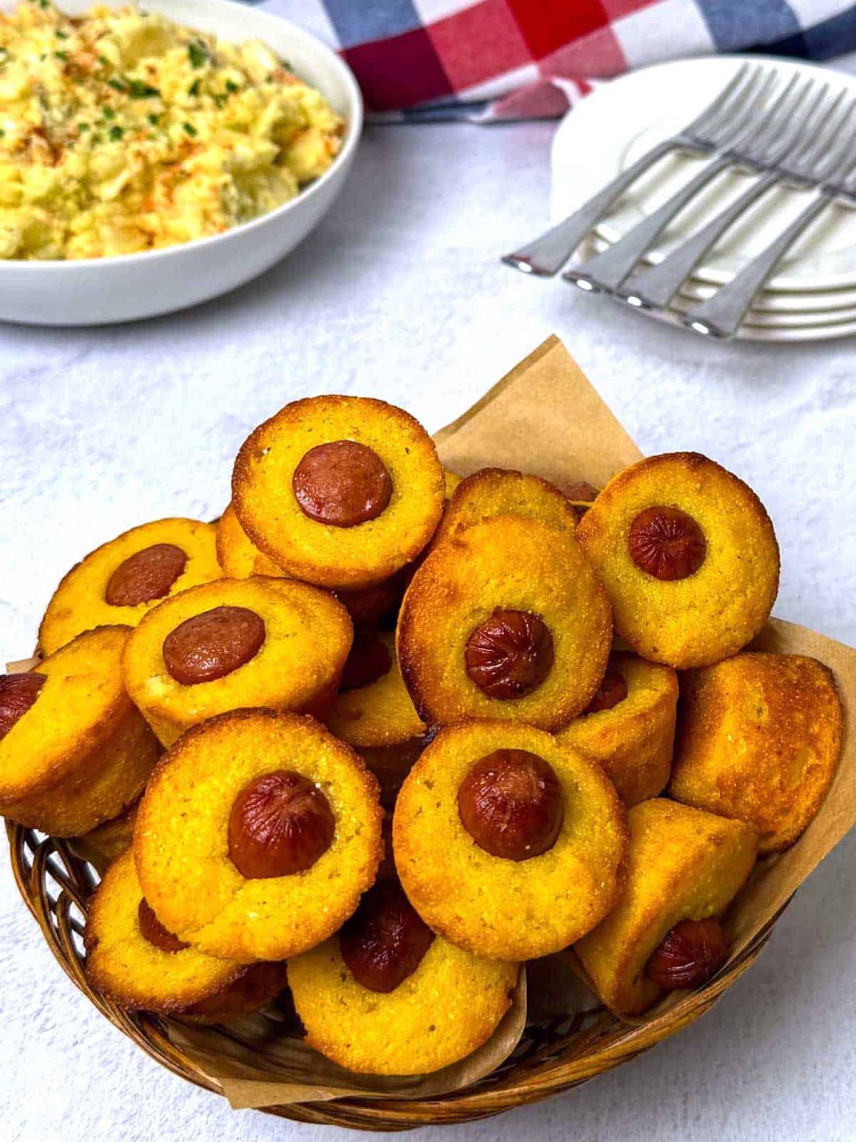 Mini corn dog muffins with potato salad.