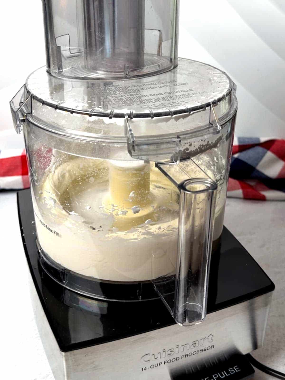 Processing dip ingredients in a food processor.