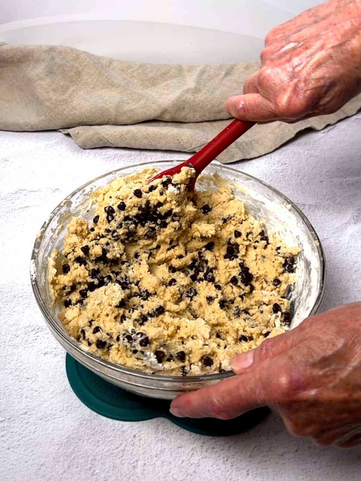 Mixing the mini chocolate chips in the cookie dough.