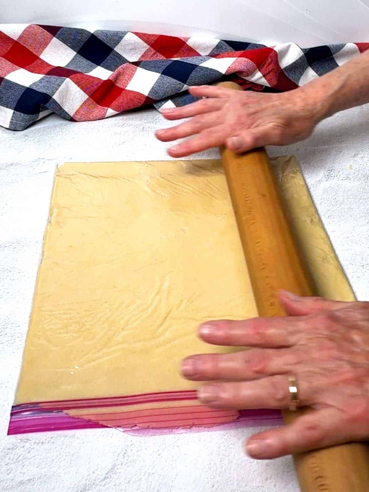 Rolling the dough in a Ziploc bag.