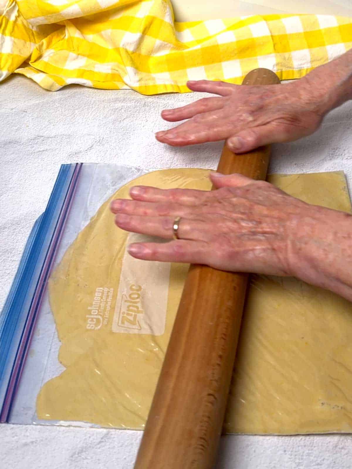 Rolling the dough in a Ziploc bag.