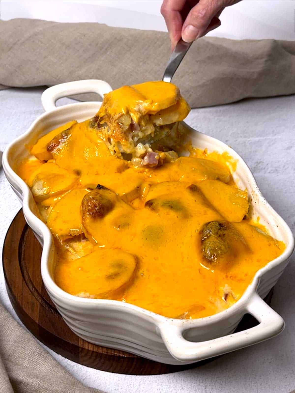 Serving Scalloped Potatoes with Ham.