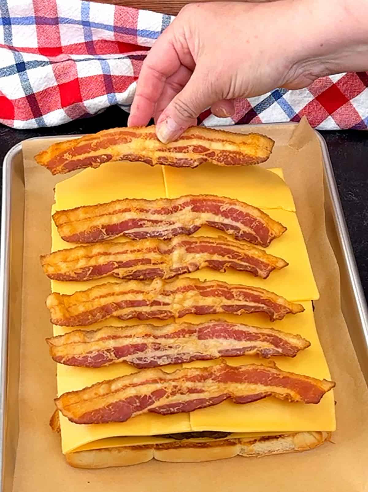 placing top layer of bacon