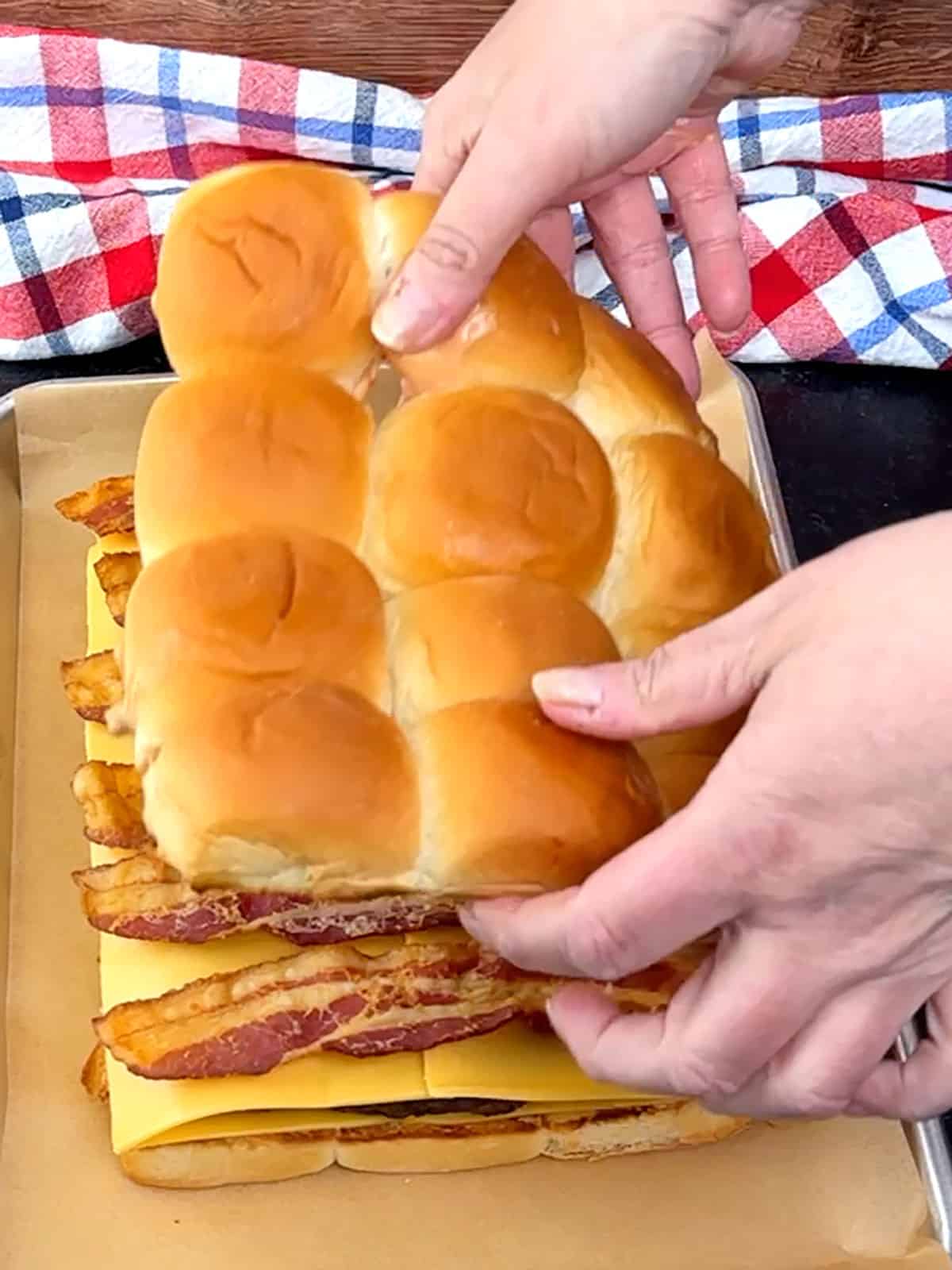 placing tops of buns to finish sliders