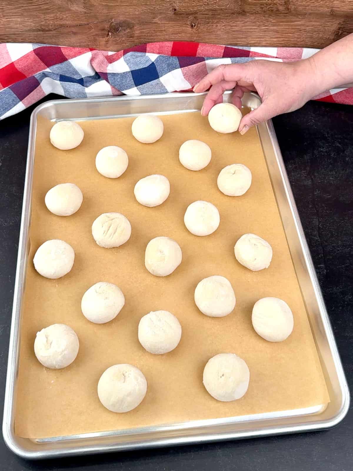 placing frozen dough on prepared sheet pan