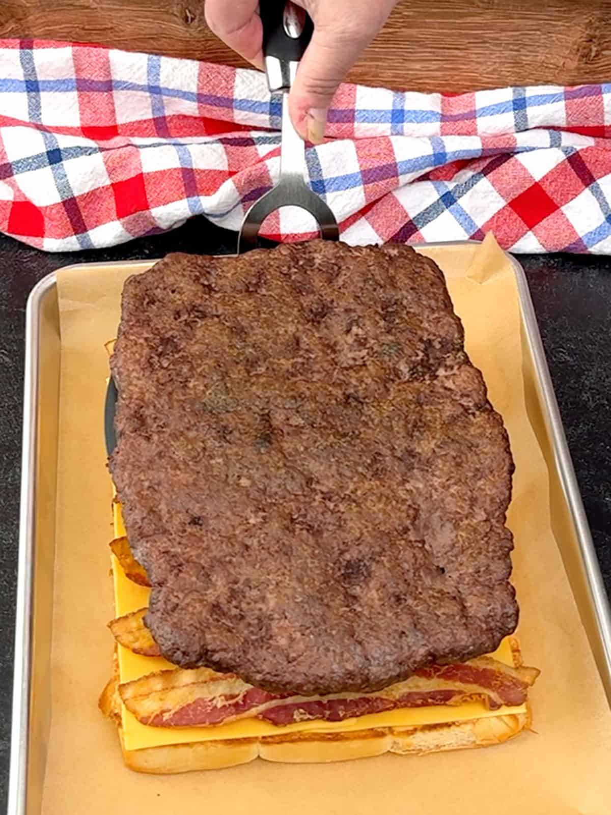 transferring meat on top of bacon