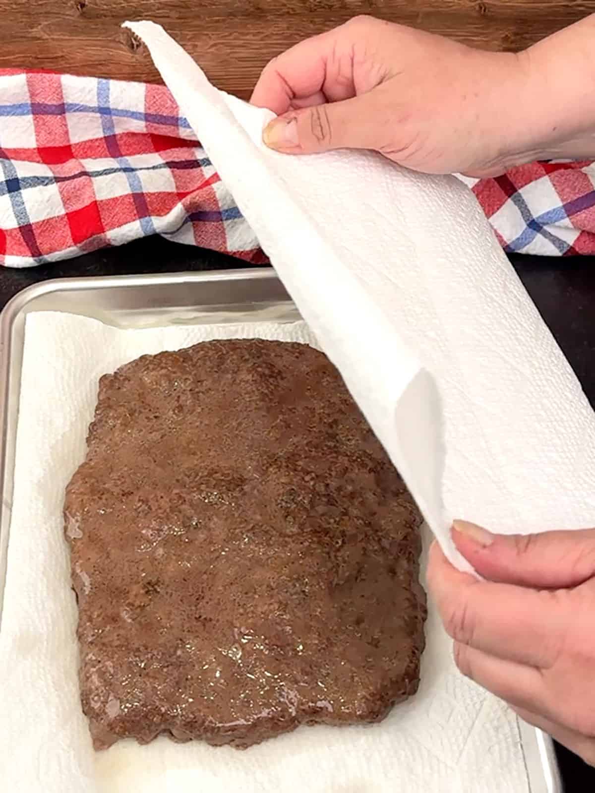 transferring meat to paper towels