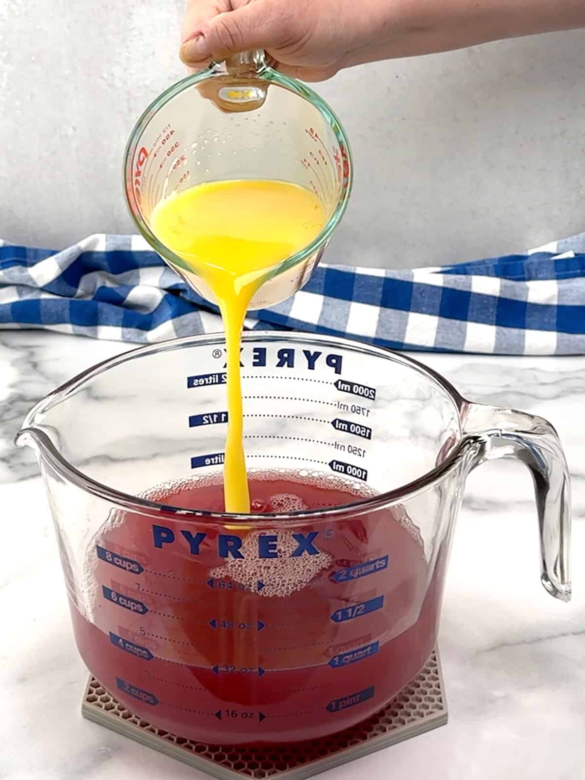 adding orange juice