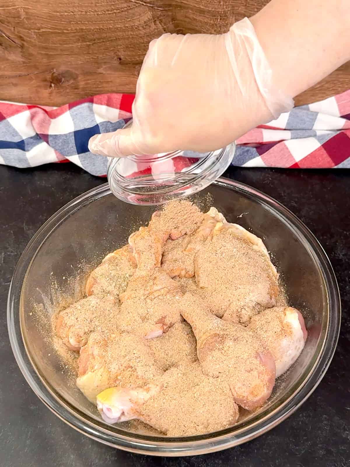 coating chicken pieces in mixed spices
