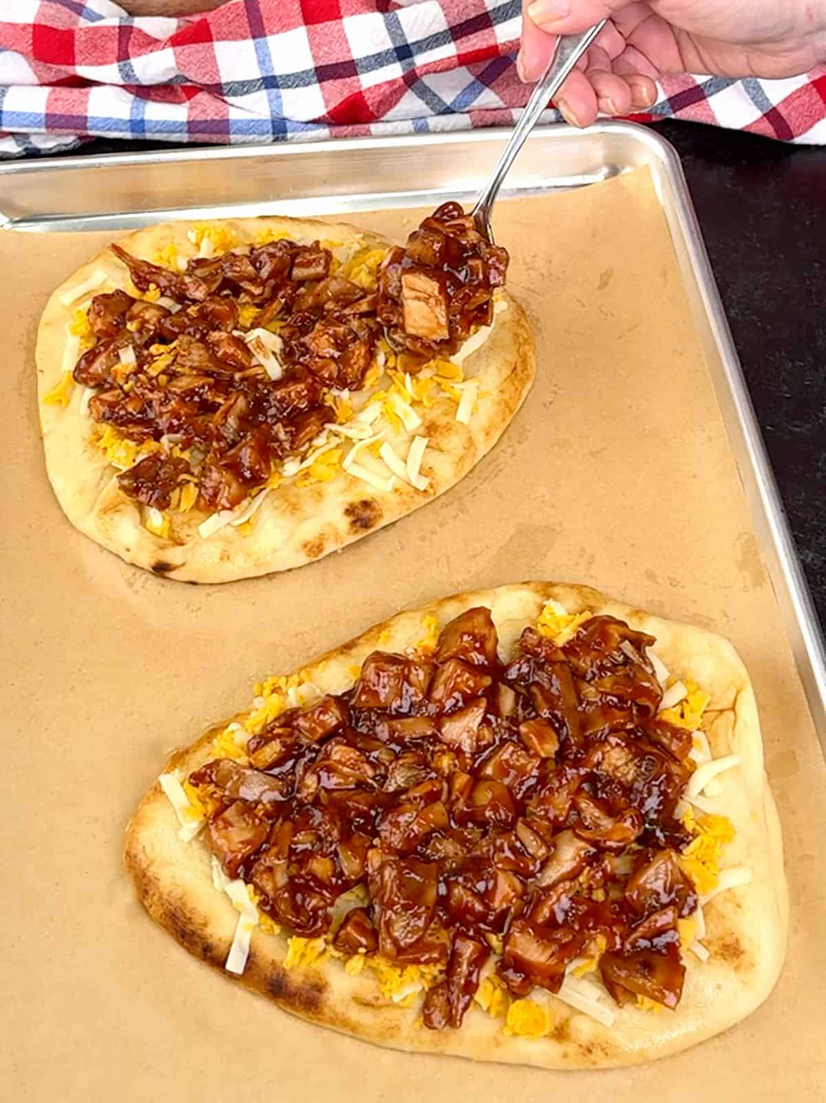 spooning chicken mixture over cheese
