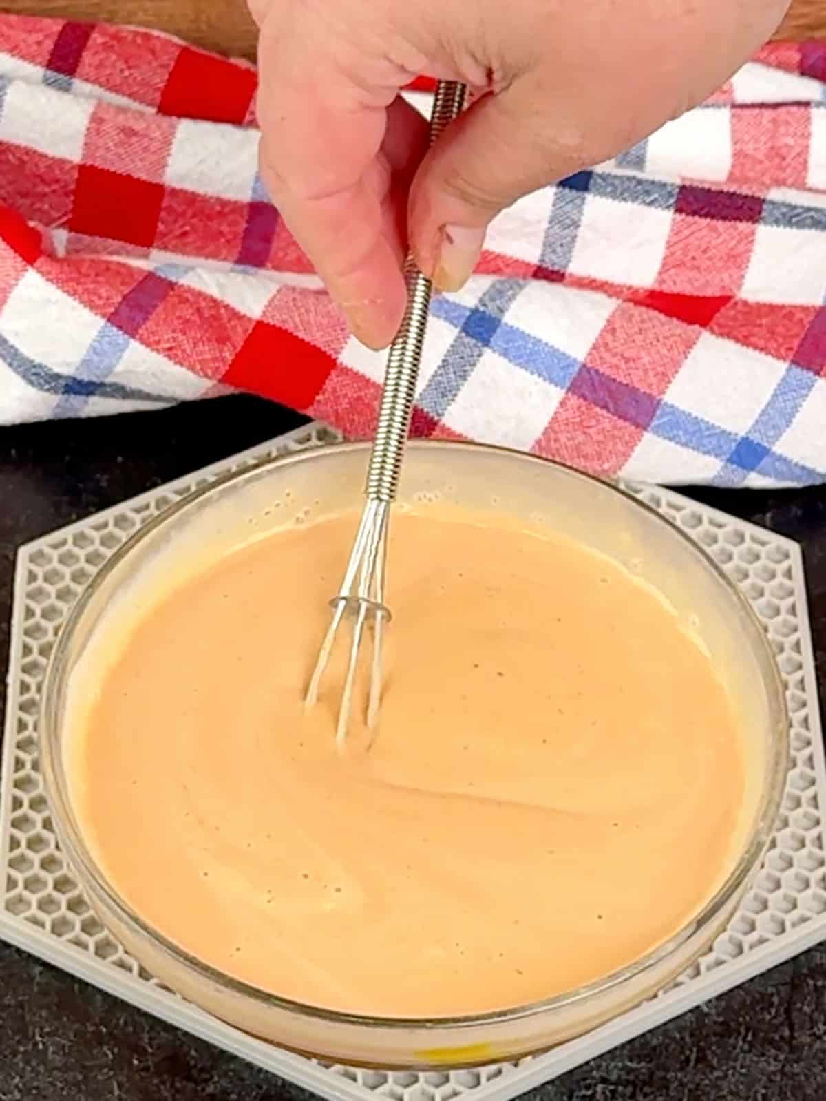 whisking sauce