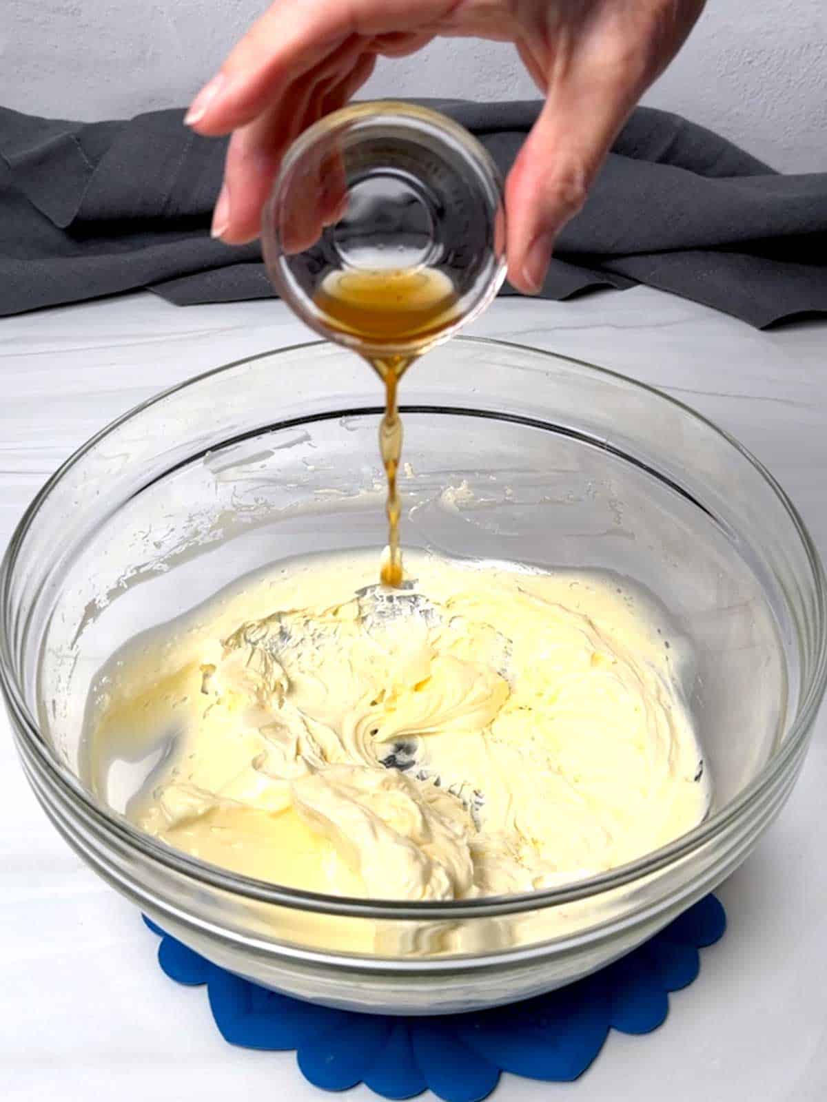 Adding vanilla to the butter.