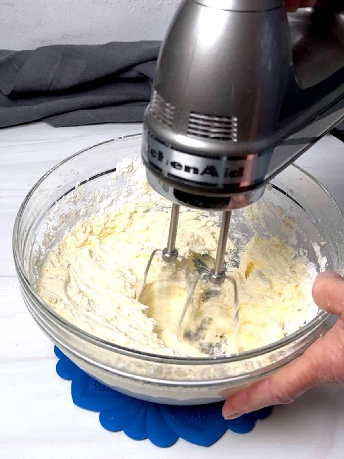 Beating the buttercream.