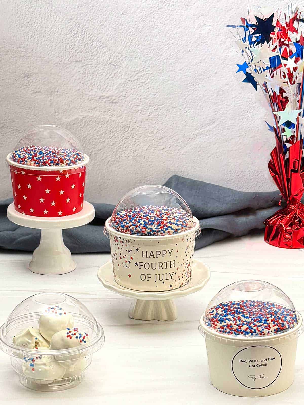 Red, white and blue dot cakes with cake pops.