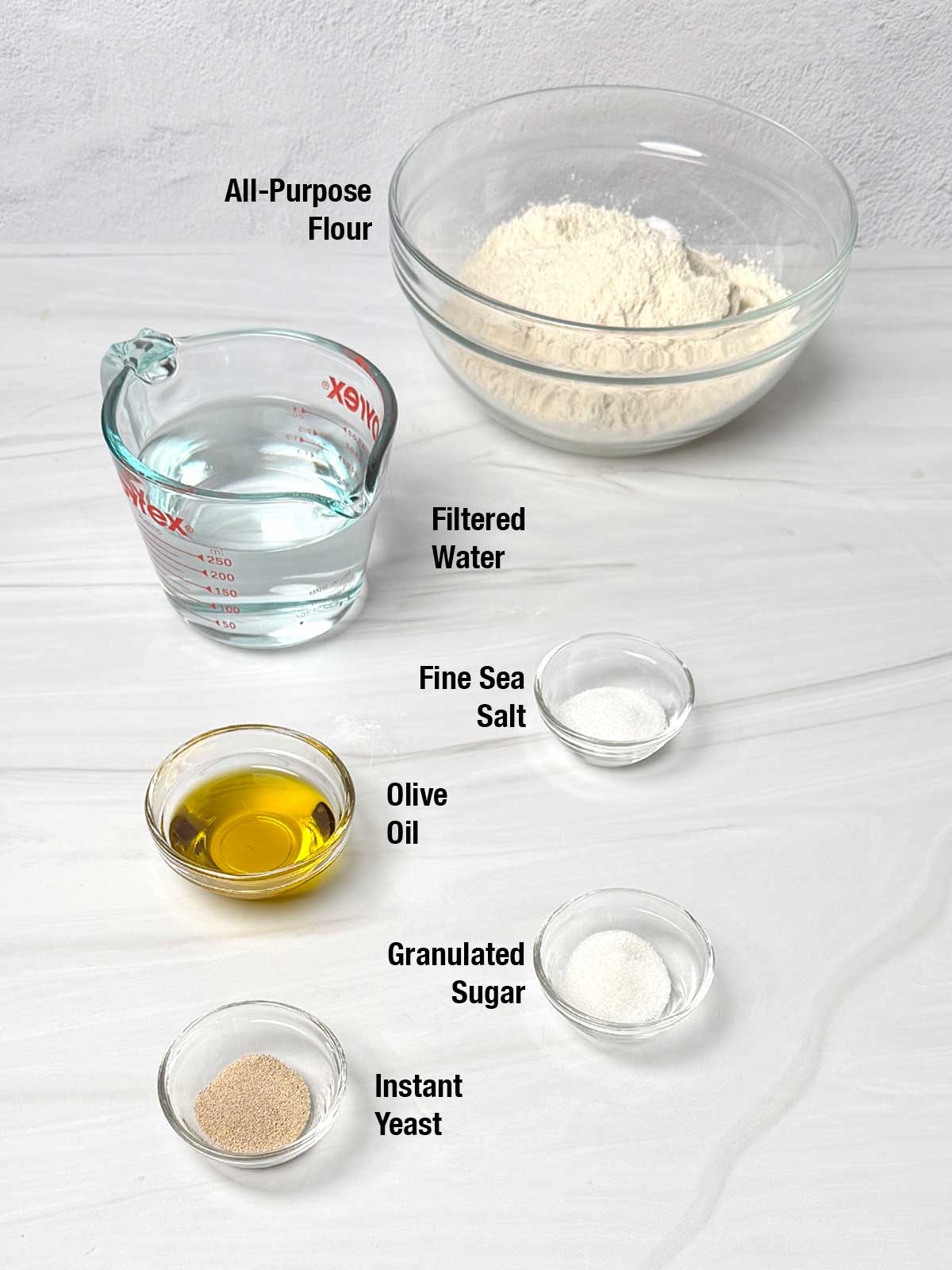 Ingredients for no-kneadd focaccia buns.