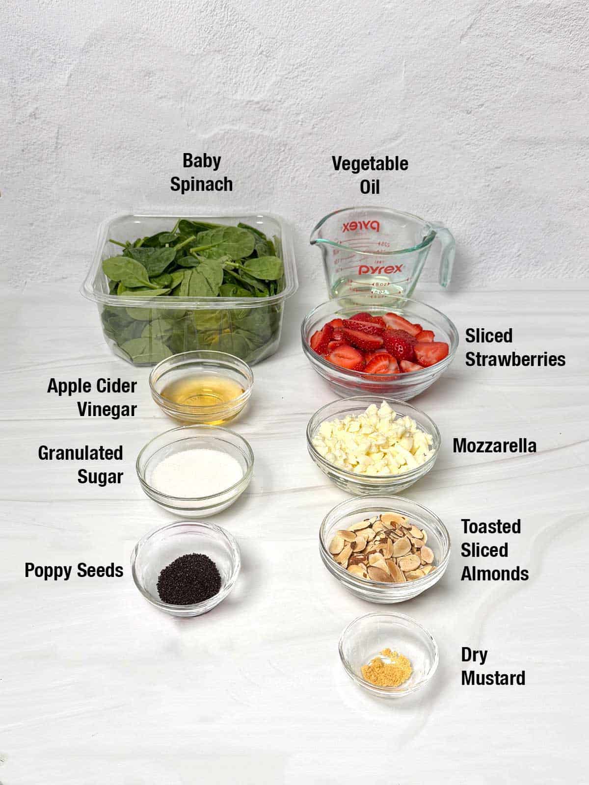 Ingredients for spinach strawberry salad.