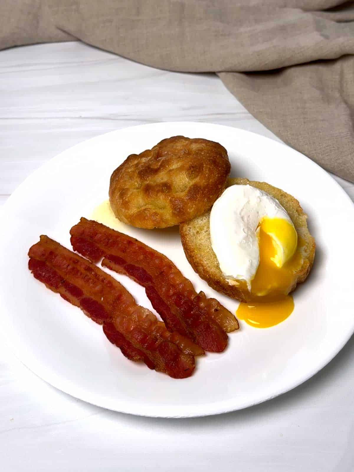 Poached egg on buttered focaccia bun.