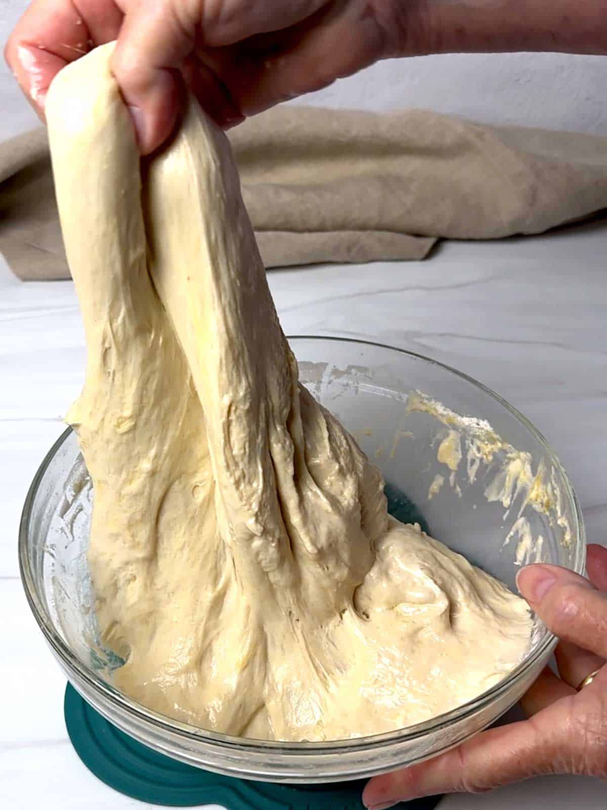 Performing stretch and fold with the dough.