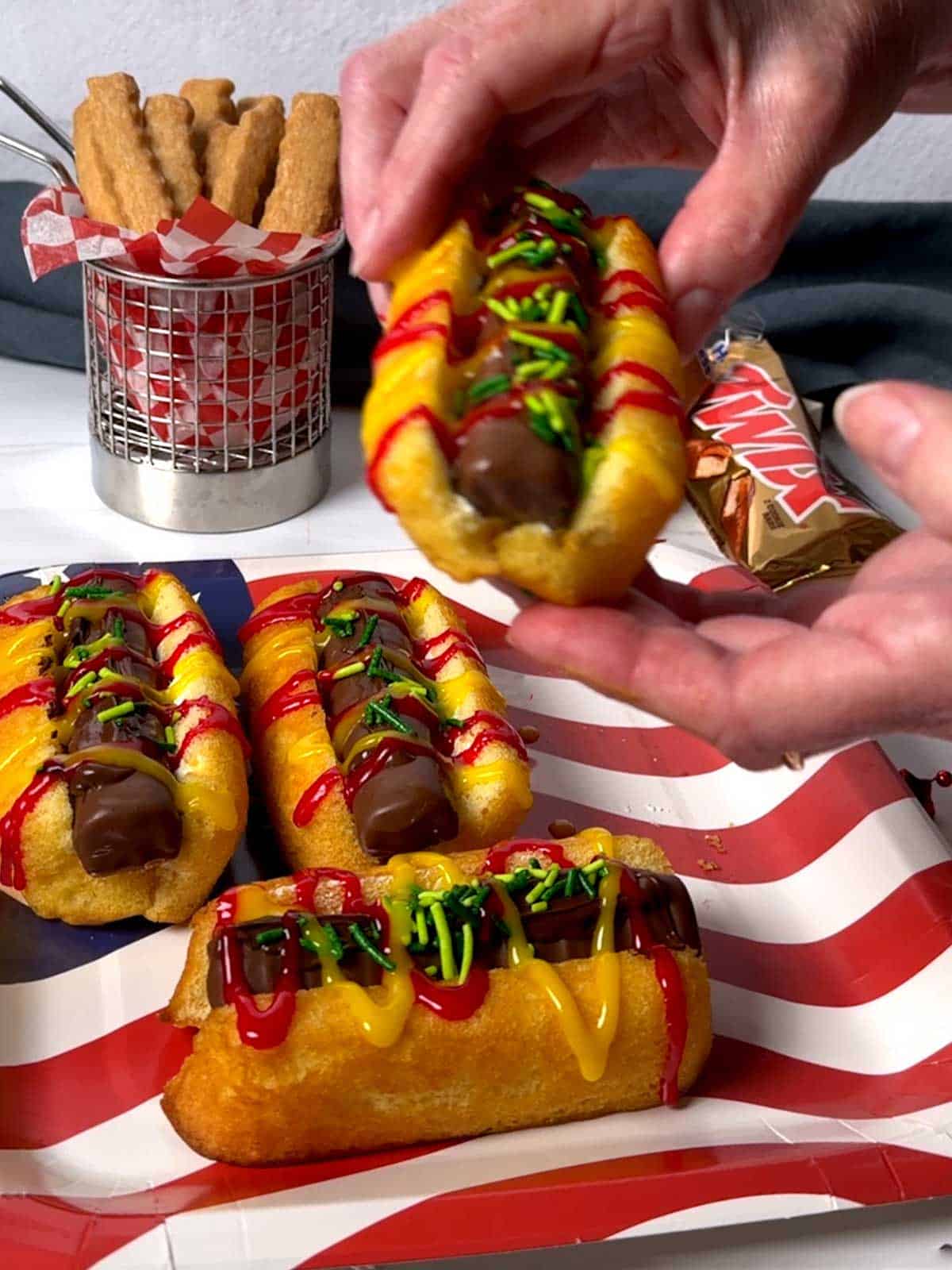 Holding the twinkie dog.