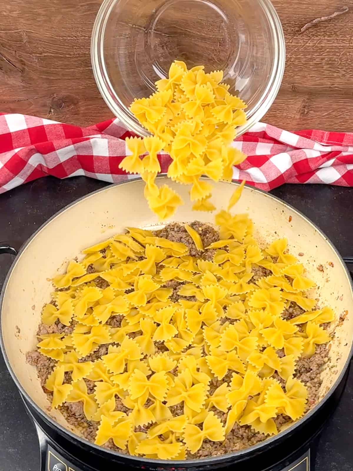 adding pasta