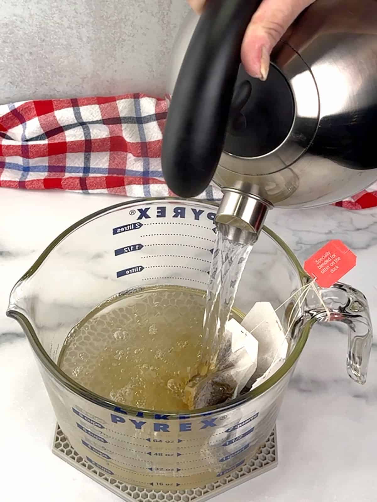 pouring boiling water over tea bags