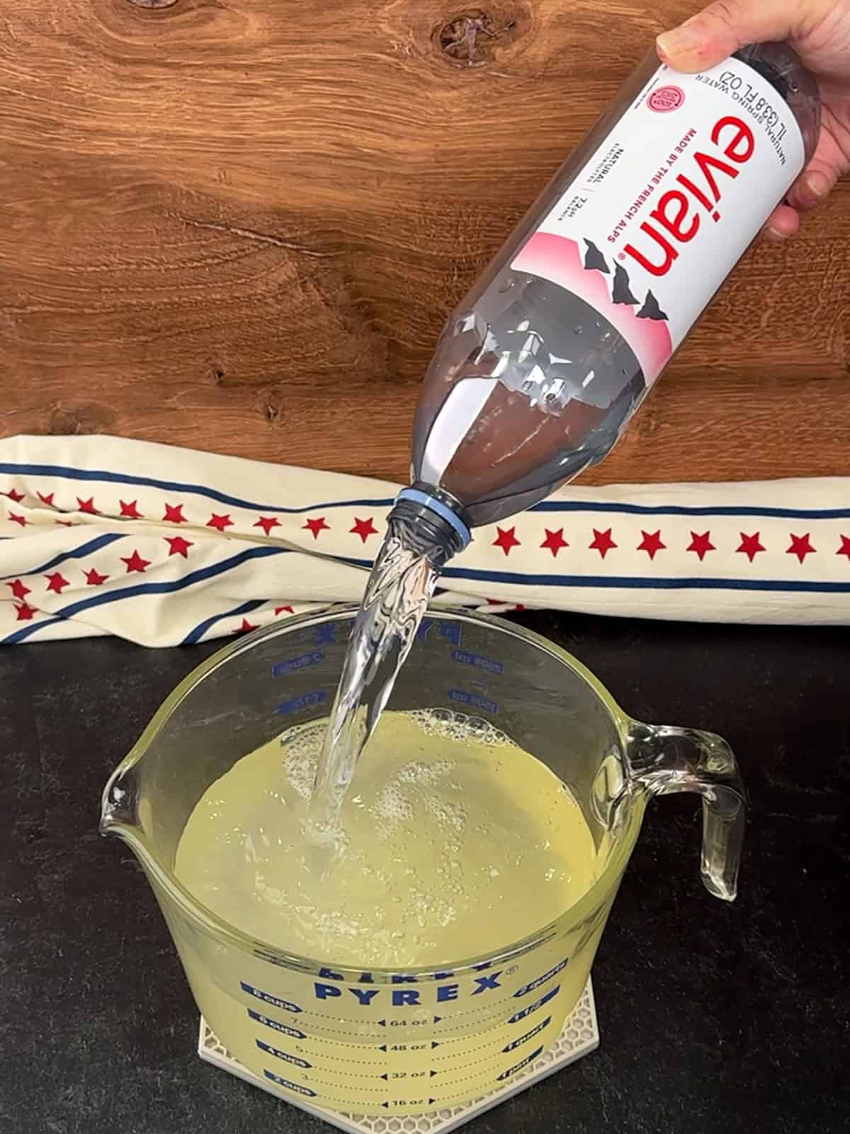 adding remaining water to lemon juice mixture