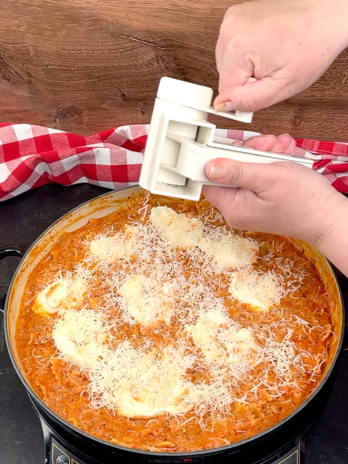 grating parmesan on top