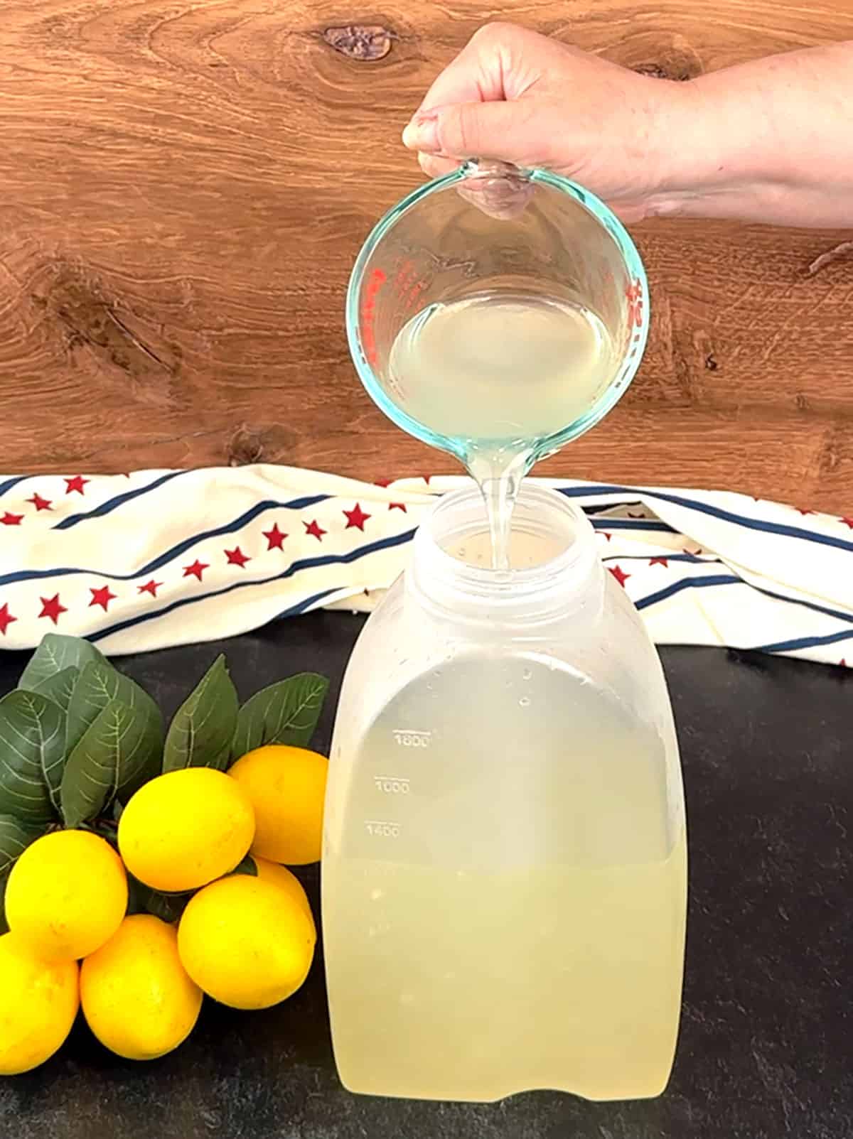 transferring lemonade to container