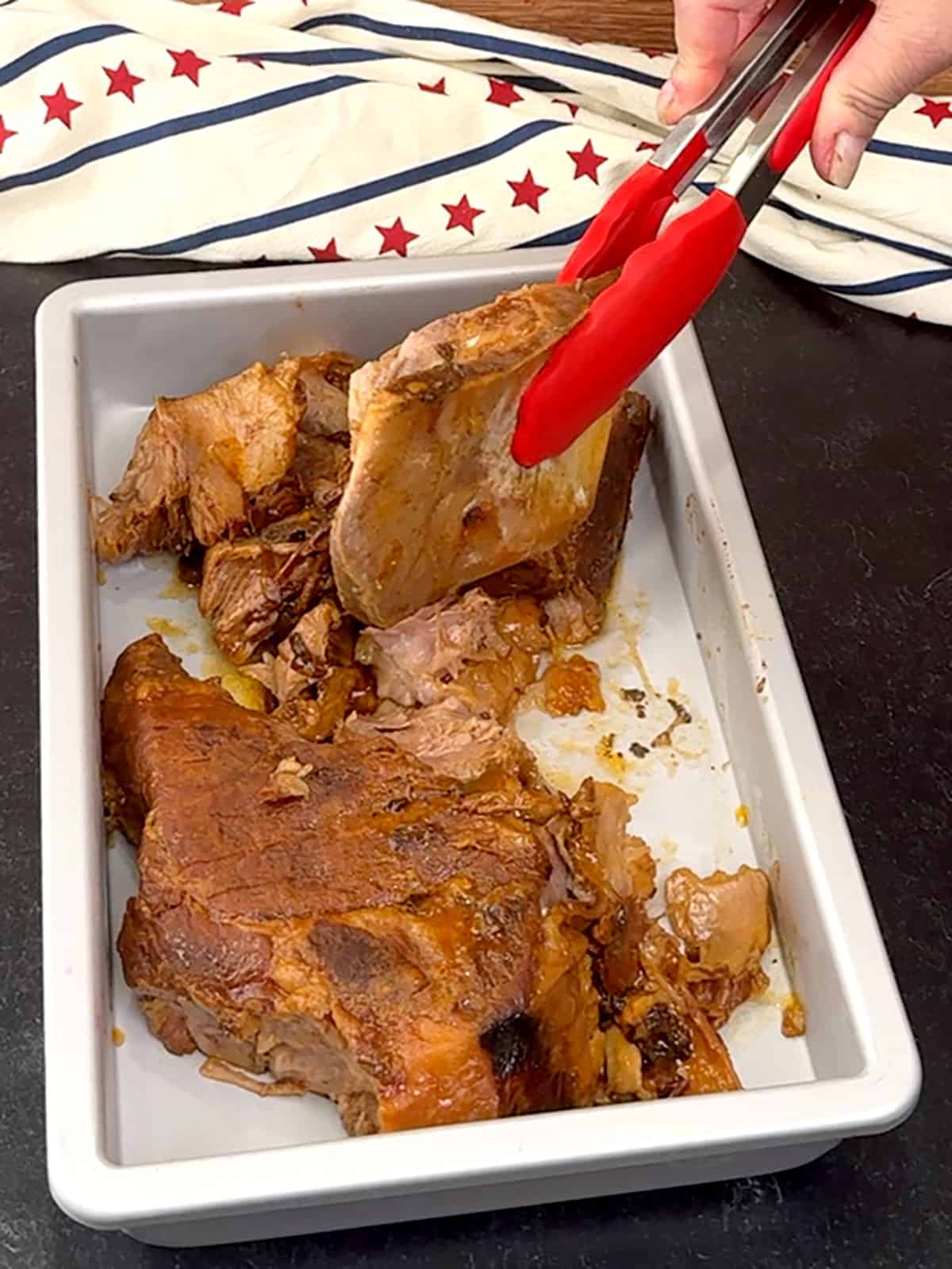 transferring pork to dish to rest