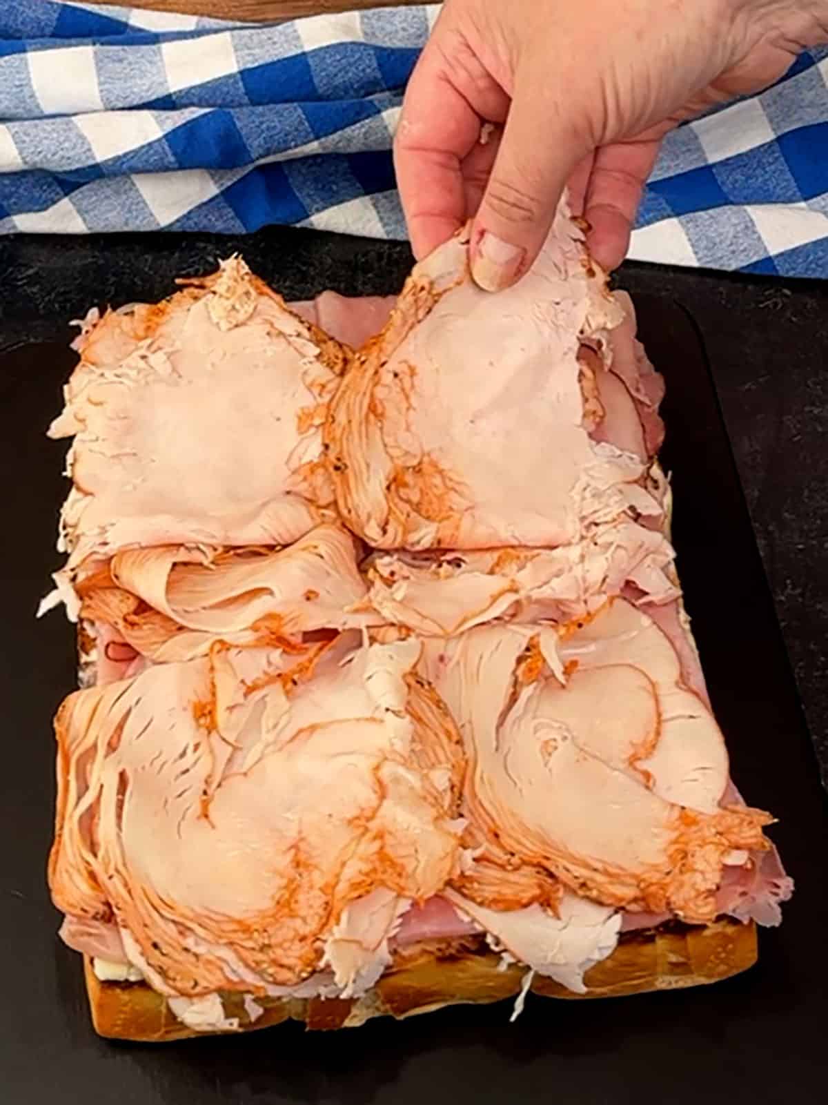 layering turkey on top of ham