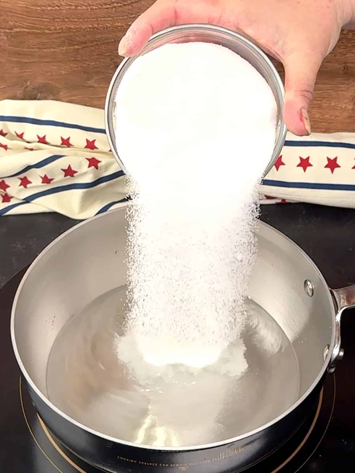 combining water and sugar in sauce pan