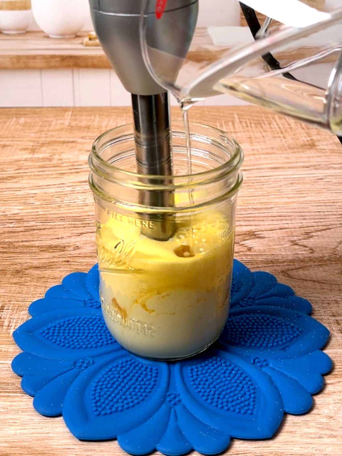 Adding oil to the salad cream