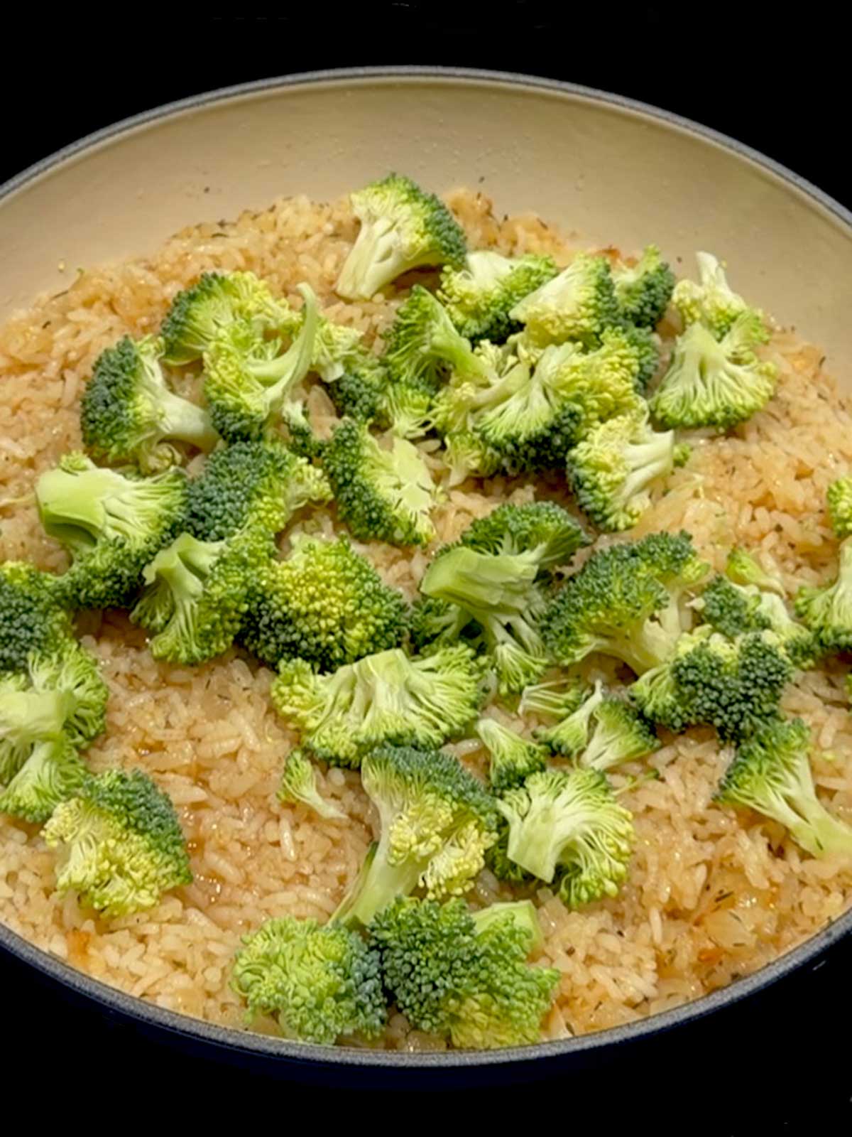 Fresh broccoli added on top of the rice.