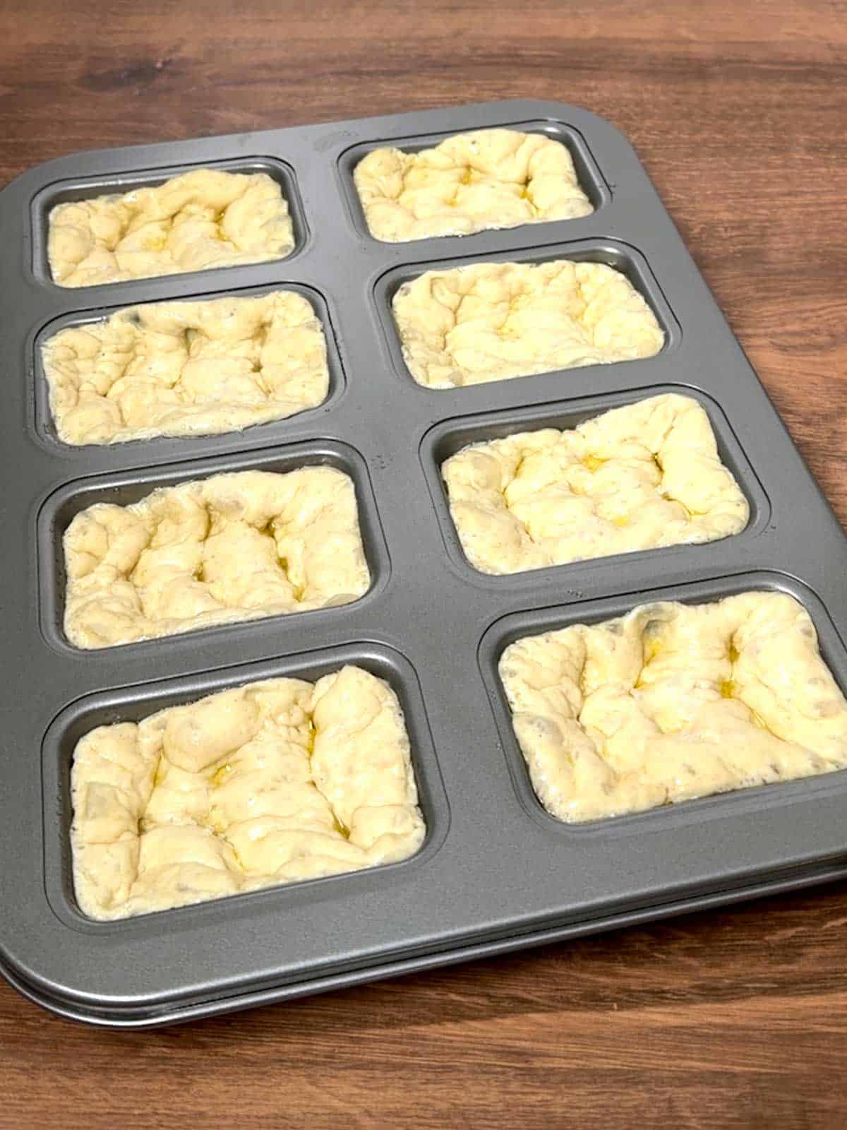 Mini focaccia loaves ready for the oven.