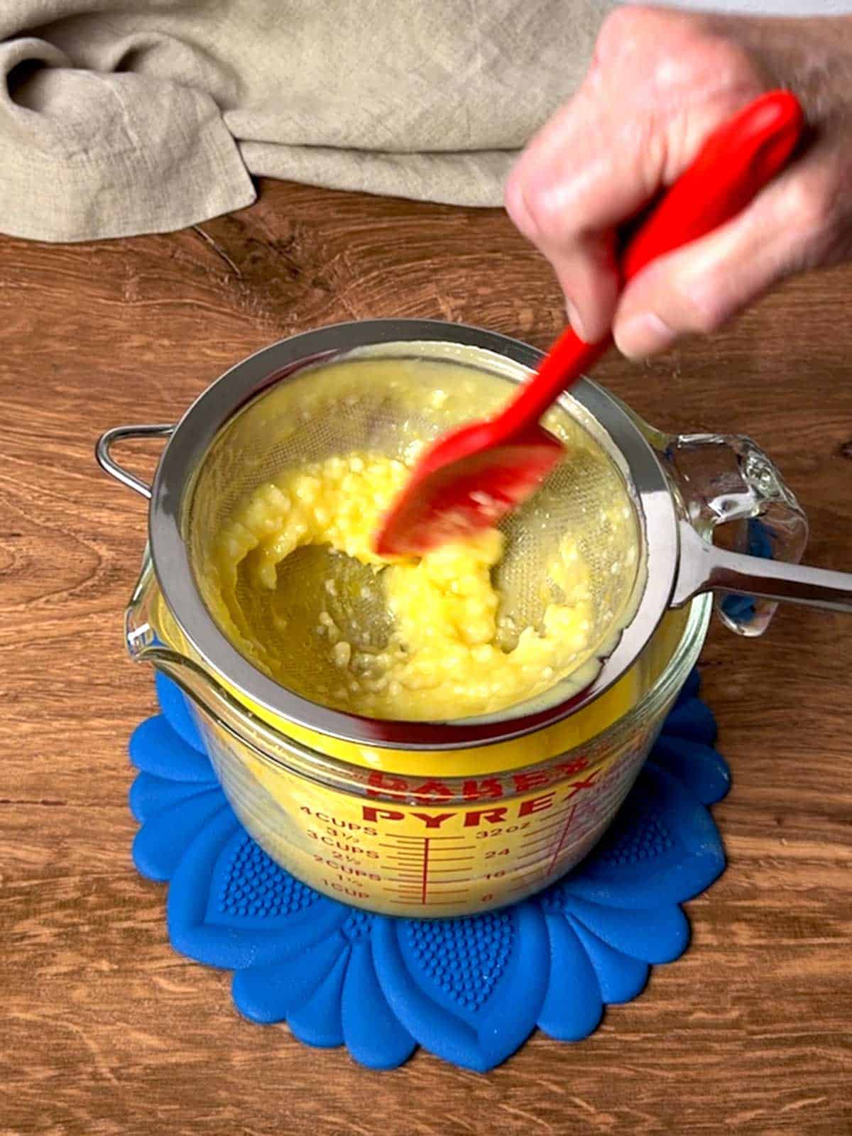 Straining the lemon curd.