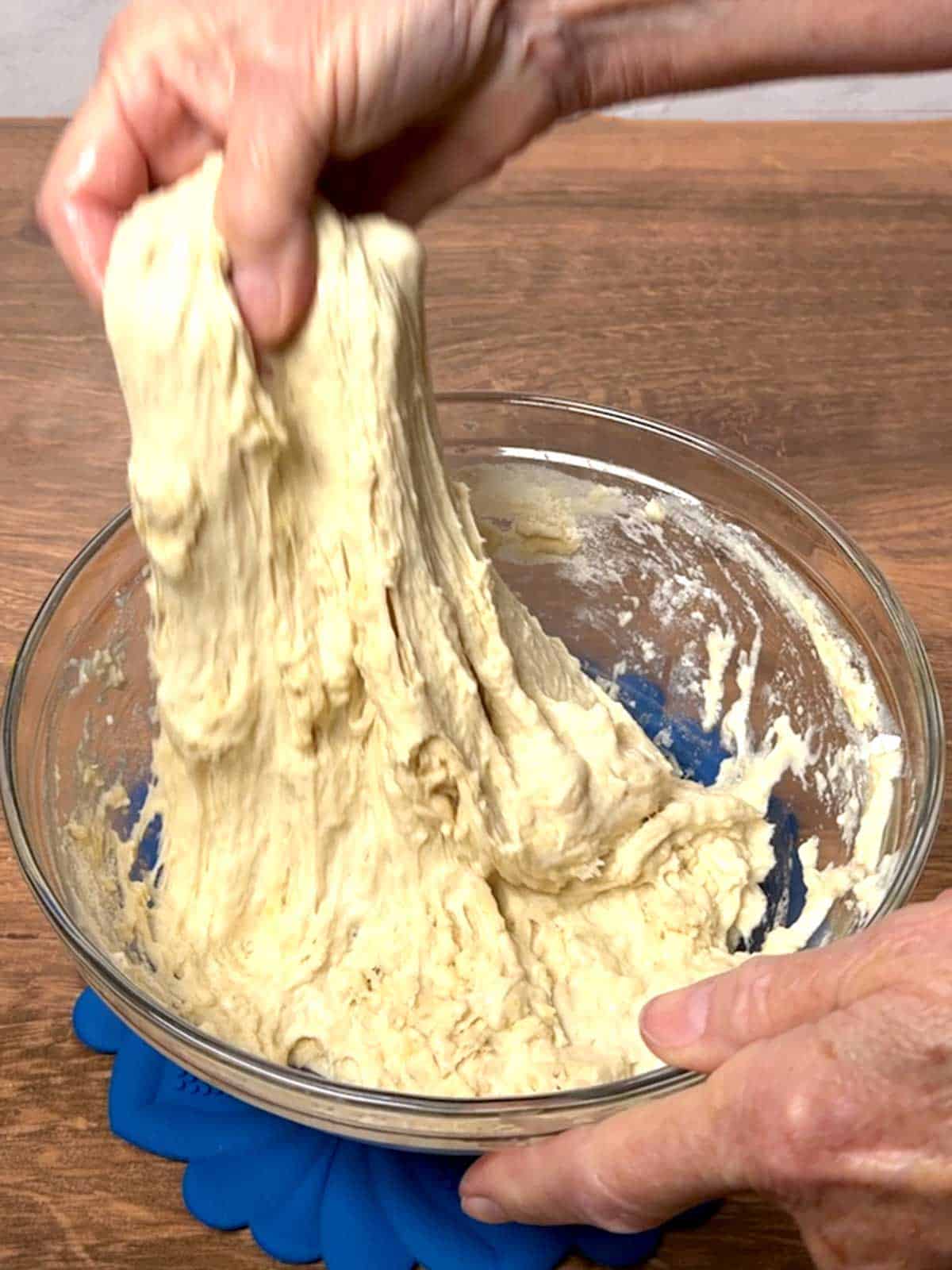 Stretching the dough.