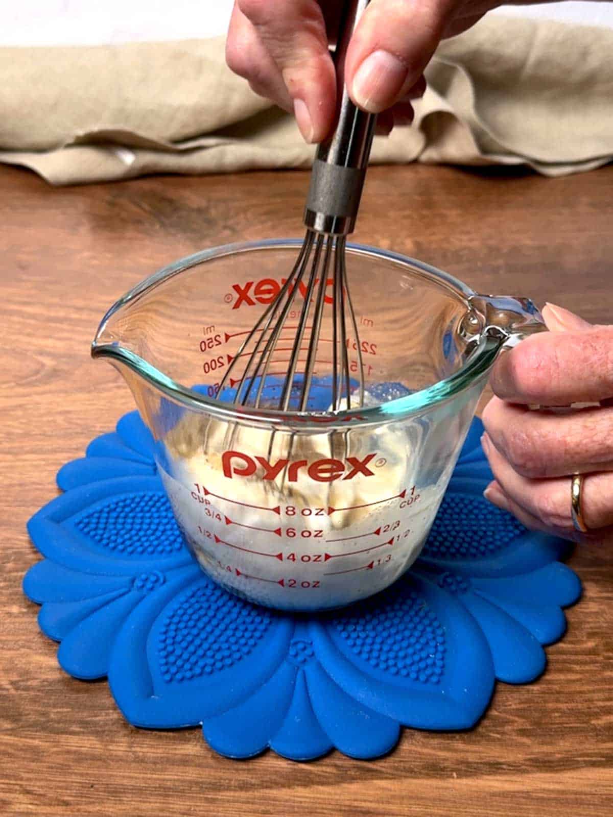 Whisking the dressing ingredients for the broccoli salad.