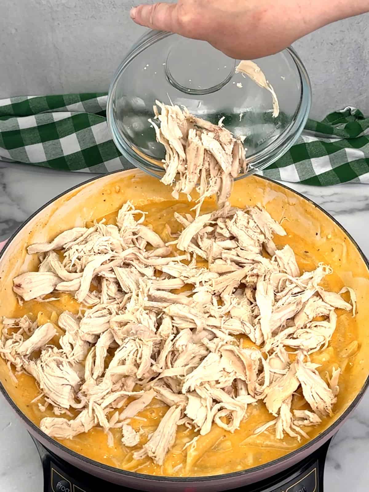 stirring in rotisserie chicken