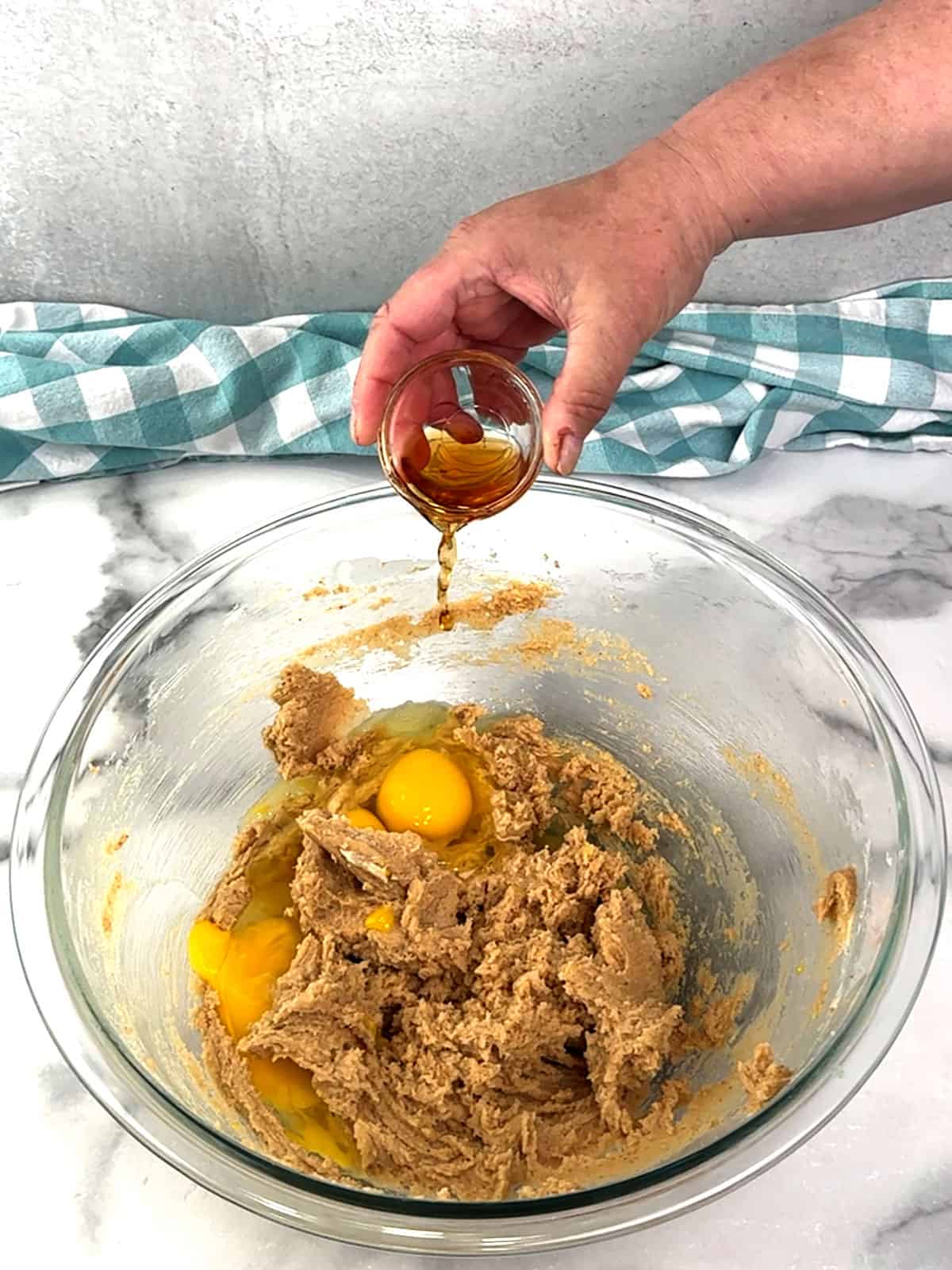 adding eggs and vanilla