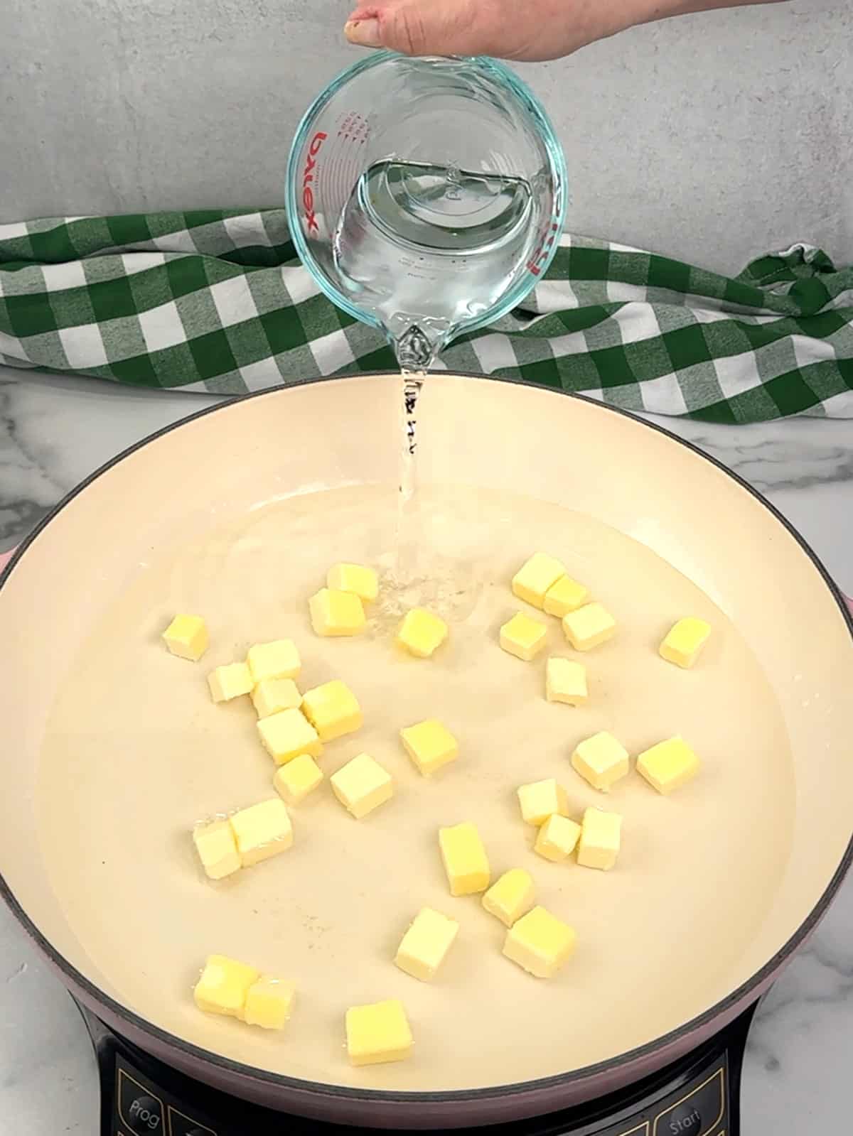 bringing butter and water to a simmer