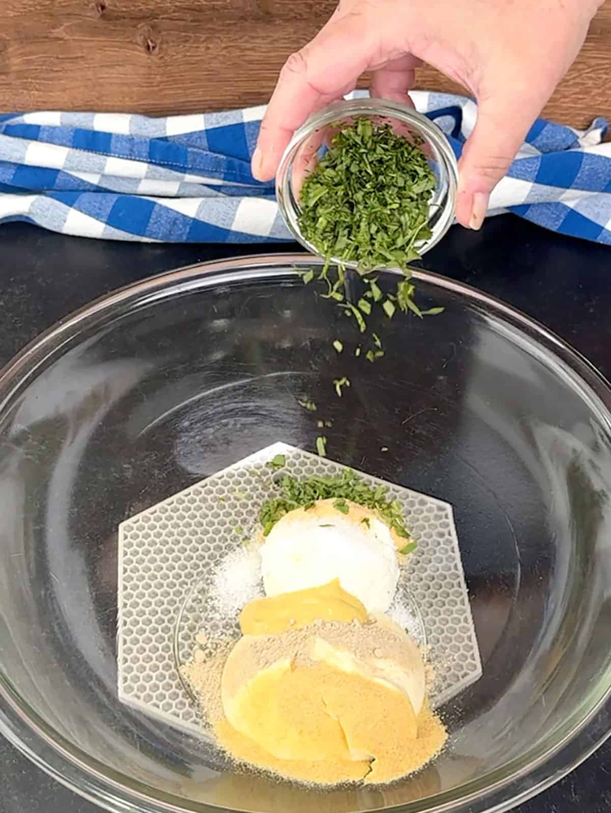 combining dressing ingredients in a bowl