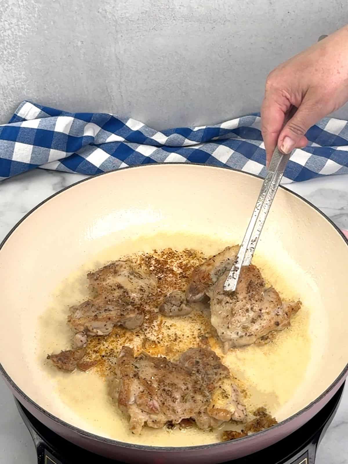 removing chicken from pan