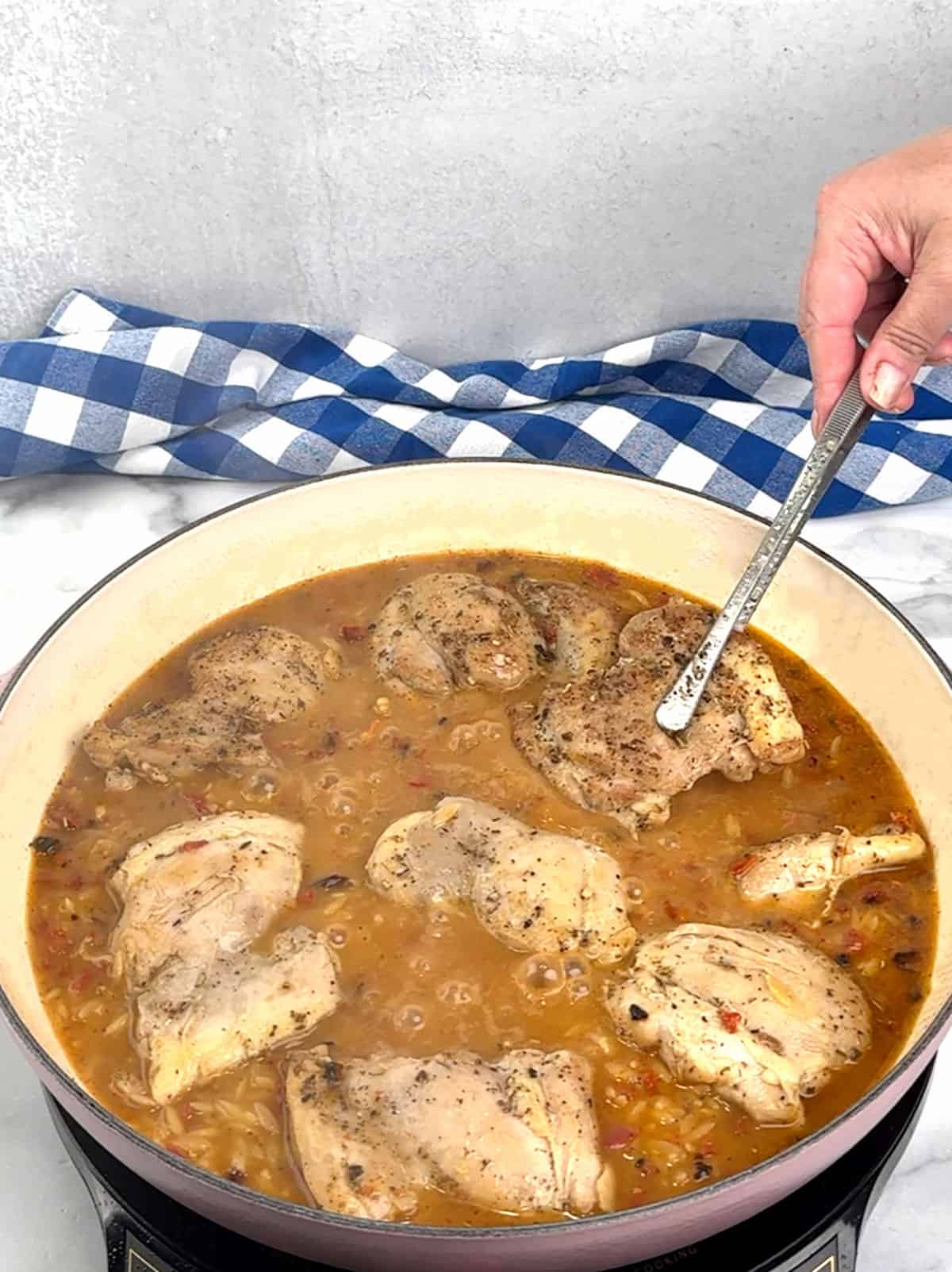 returning chicken to pan