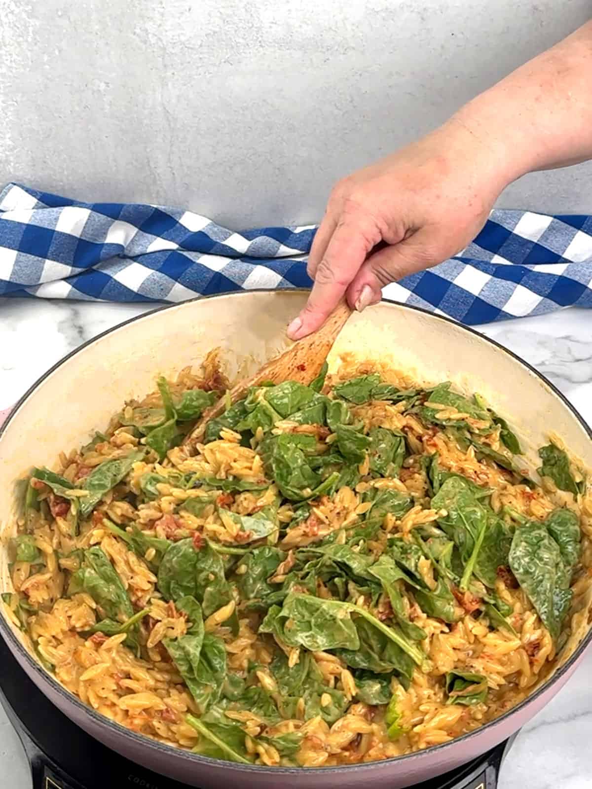 stirring spinach