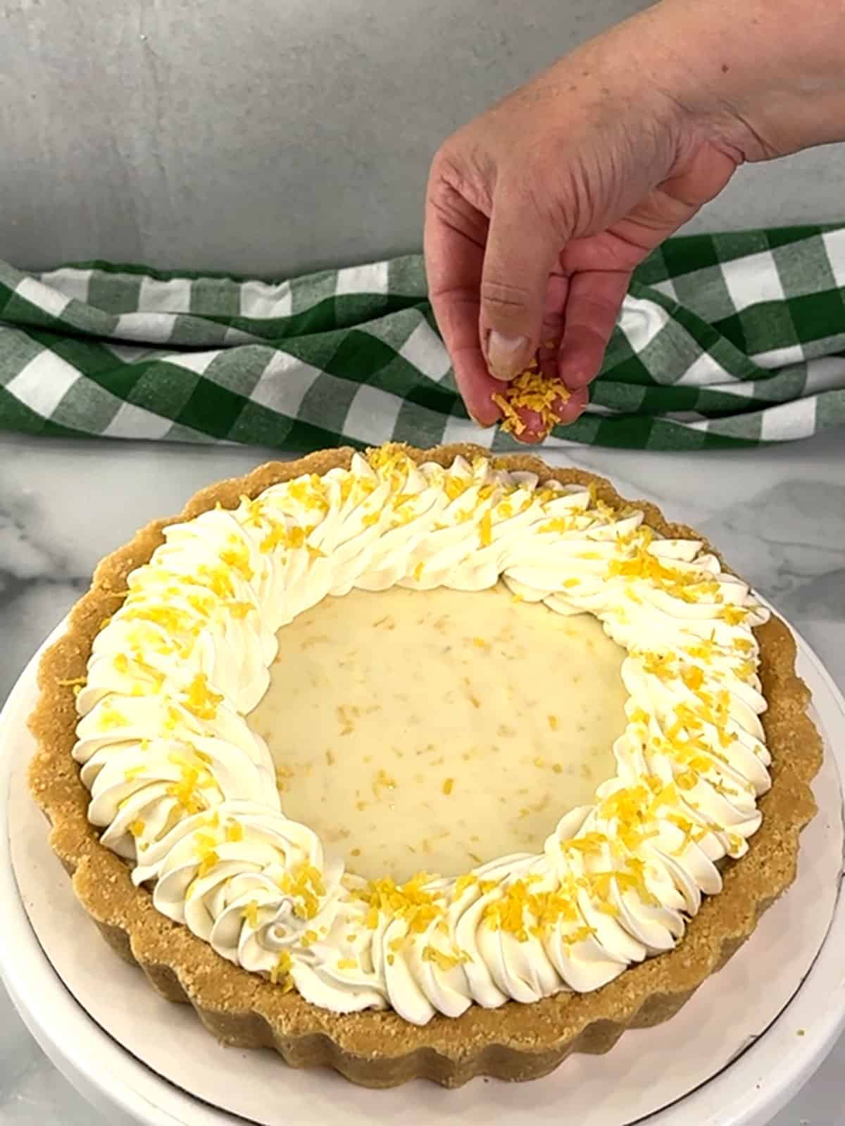 sprinkling zest on top of whipped cream